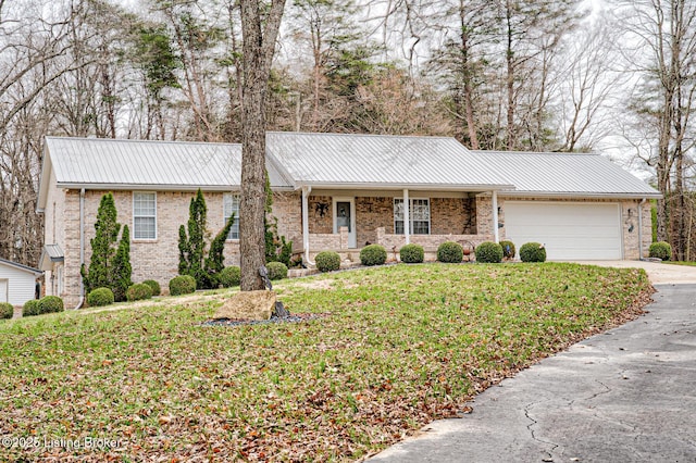 1670 Pine Creek Trl, Shepherdsville, KY 40165 - ranch-style house featuring brick siding, driveway, metal roof, and a garage