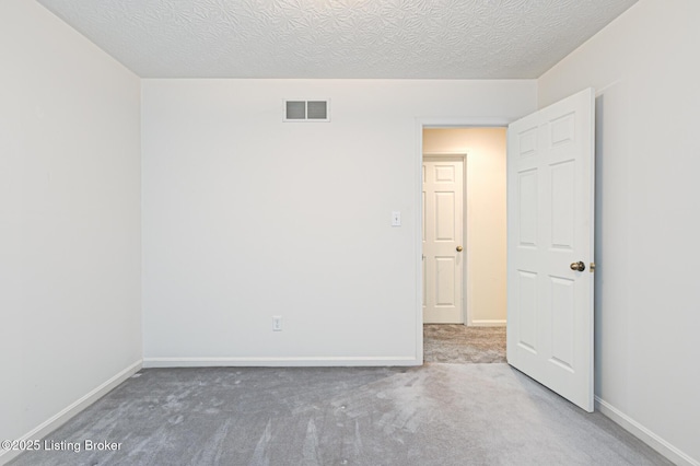1670 Pine Creek Trl, Shepherdsville, KY 40165 - empty room with visible vents, baseboards, carpet, and a textured ceiling
