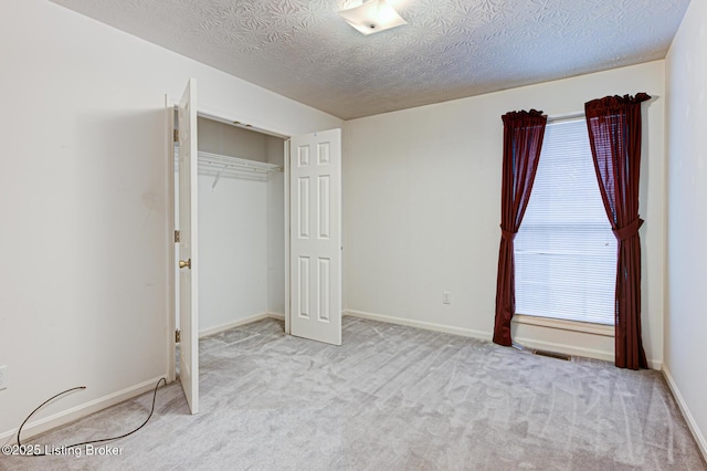 1670 Pine Creek Trl, Shepherdsville, KY 40165 - unfurnished bedroom with carpet, visible vents, baseboards, a closet, and a textured ceiling