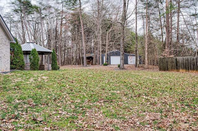 1670 Pine Creek Trl, Shepherdsville, KY 40165 - view of yard featuring an outbuilding, fence, and a garage