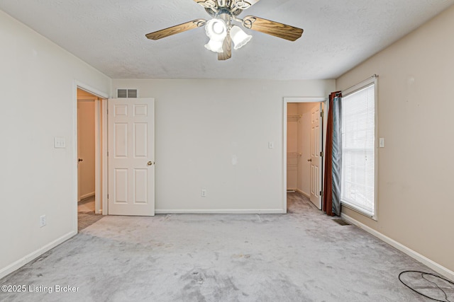 1670 Pine Creek Trl, Shepherdsville, KY 40165 - unfurnished bedroom featuring visible vents, carpet floors, baseboards, and a walk in closet