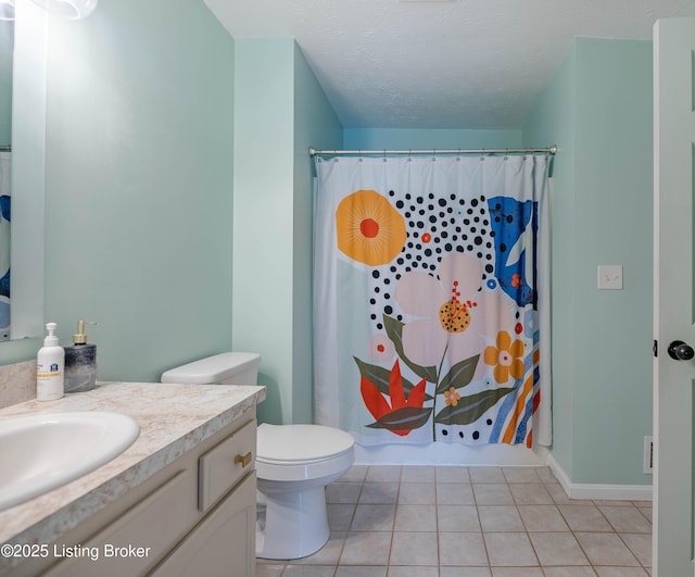 full bath with tile patterned floors, toilet, curtained shower, a textured ceiling, and vanity