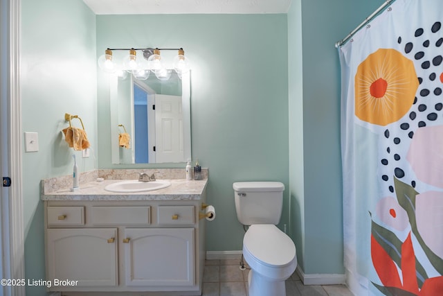 bathroom featuring tile patterned flooring, baseboards, toilet, a shower with shower curtain, and vanity