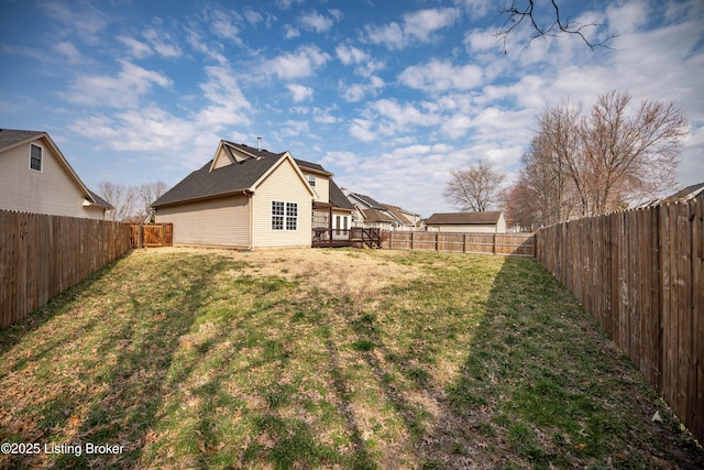 view of yard with a fenced backyard