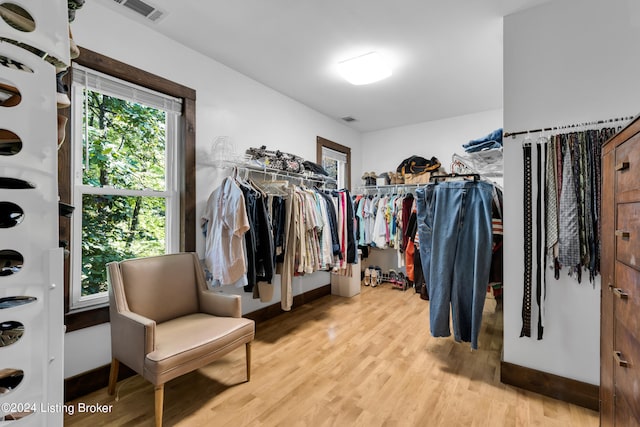 spacious closet featuring wood finished floors and visible vents