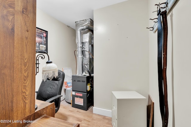 interior space with light wood-style floors and baseboards