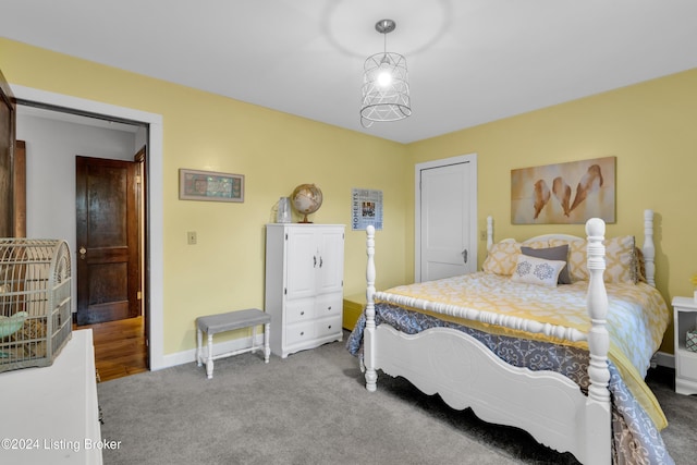 carpeted bedroom featuring baseboards