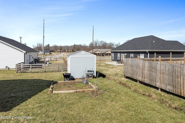 view of yard with an outdoor structure and fence