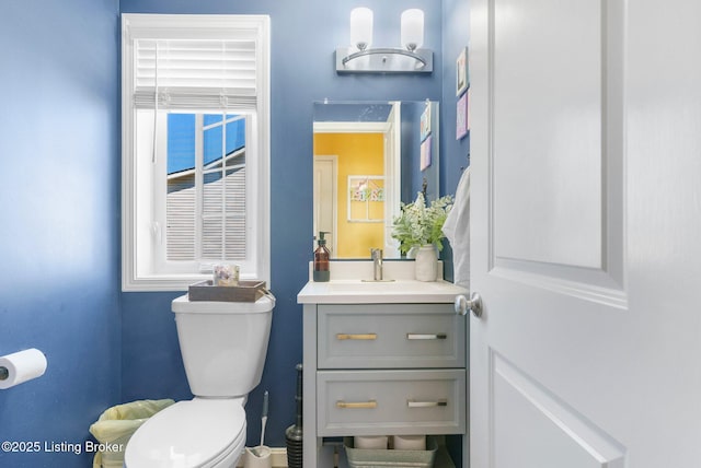 half bath with vanity and toilet