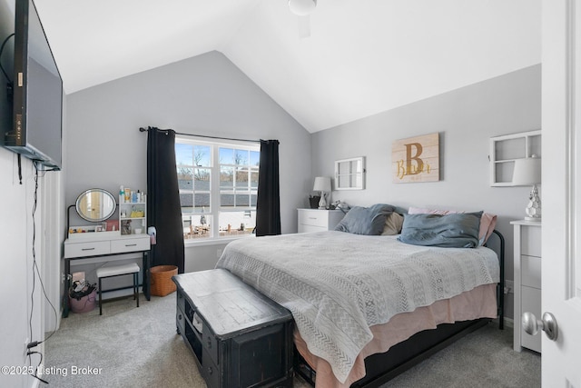 bedroom with vaulted ceiling and carpet floors