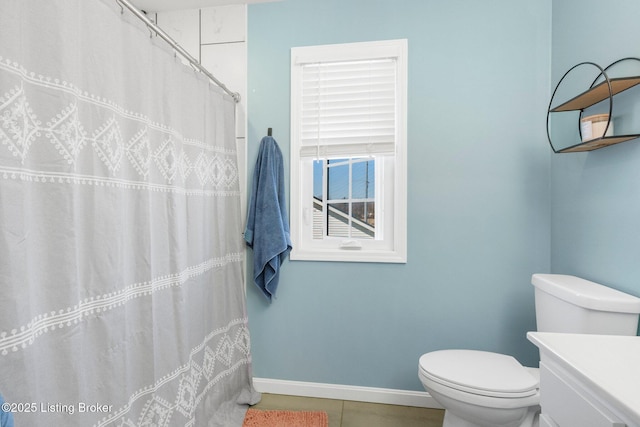 bathroom with tile patterned flooring, a shower with shower curtain, toilet, and baseboards