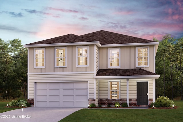 view of front facade with brick siding, an attached garage, board and batten siding, a yard, and driveway