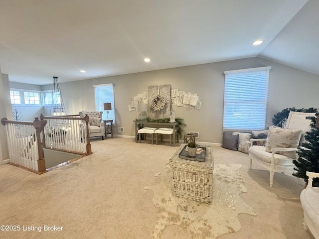 carpeted living area featuring recessed lighting, baseboards, and vaulted ceiling