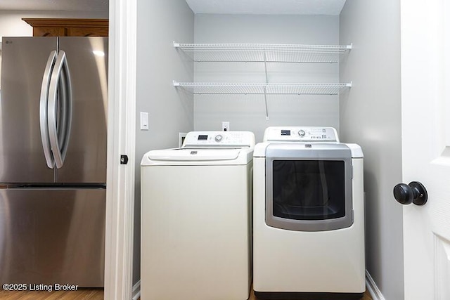 clothes washing area with laundry area and washing machine and dryer