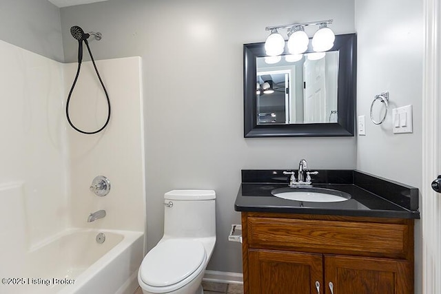 full bathroom featuring toilet, vanity, and bathtub / shower combination