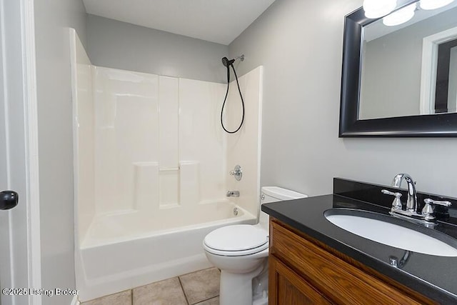 full bathroom with vanity, tile patterned floors, toilet, and shower / bathtub combination