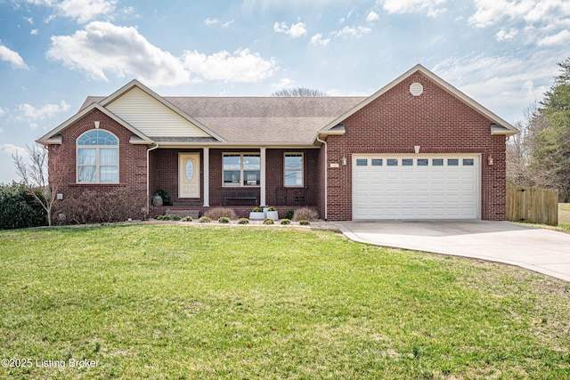 ranch-style home featuring a front yard, fence, driveway, a garage, and brick siding