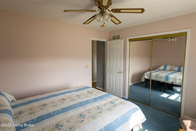 carpeted bedroom with visible vents, baseboards, a closet, and a ceiling fan