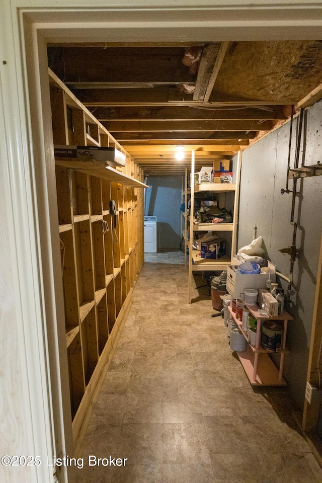 unfinished basement featuring washer / clothes dryer