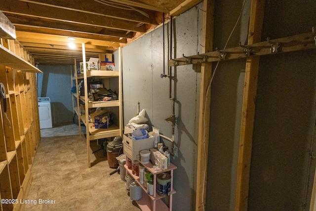 unfinished basement with washer / clothes dryer