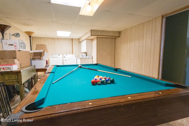 playroom with a drop ceiling, separate washer and dryer, wood walls, and billiards