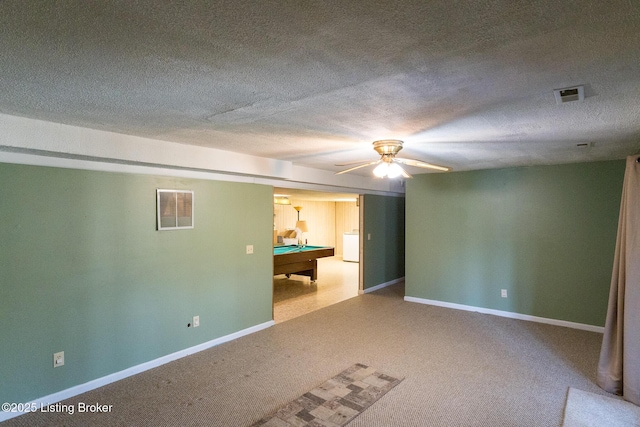 empty room with pool table, visible vents, carpet floors, and a textured ceiling