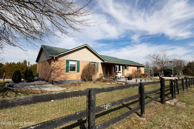 view of front of house featuring a fenced front yard and brick siding