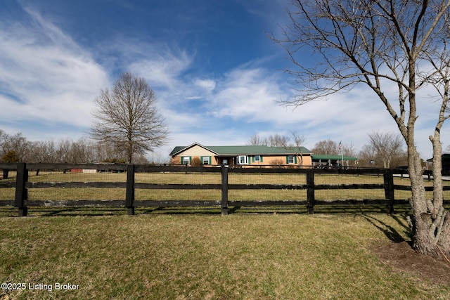 view of yard featuring a rural view and fence