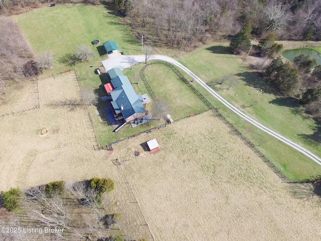 birds eye view of property featuring a rural view