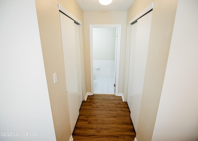 hallway featuring dark wood finished floors