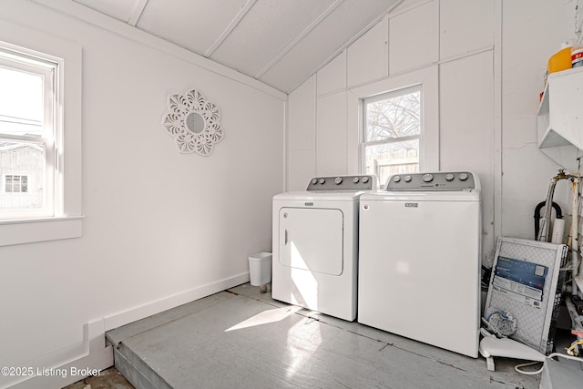 laundry room featuring washer and dryer, baseboards, and laundry area