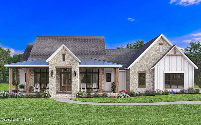 modern farmhouse style home with stone siding, board and batten siding, a porch, and a front yard