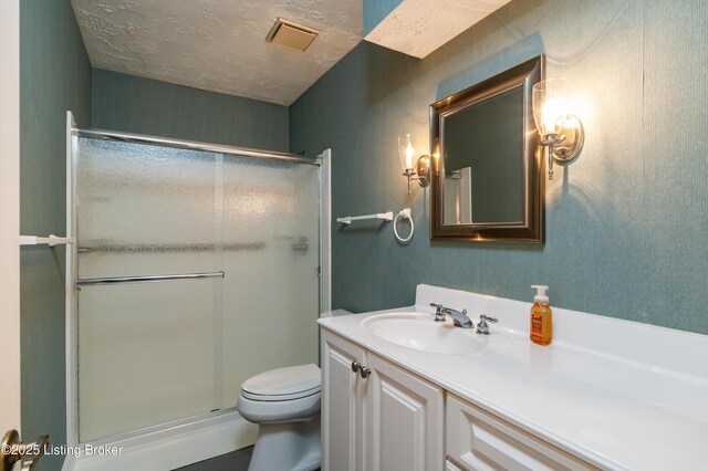 5800 Coach Gate Wynde Unit 295B, Louisville, KY 40207 - full bath with toilet, a stall shower, vanity, and a textured ceiling