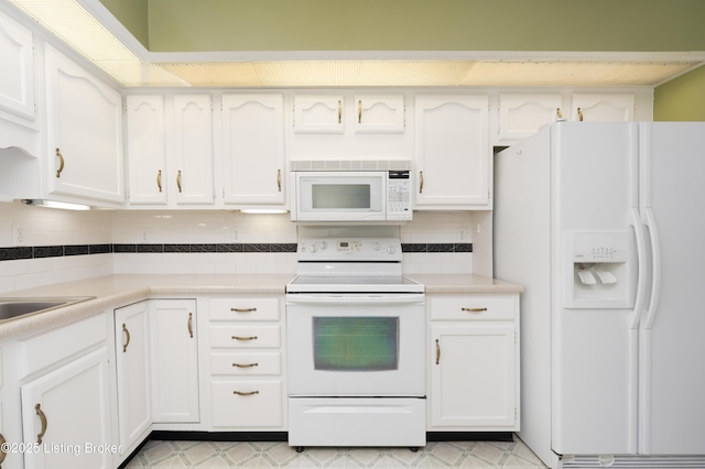 5800 Coach Gate Wynde Unit 295B, Louisville, KY 40207 - kitchen featuring tasteful backsplash, white appliances, and white cabinetry