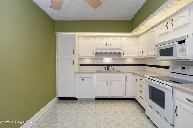 5800 Coach Gate Wynde Unit 295B, Louisville, KY 40207 - kitchen with light floors, light countertops, white cabinets, white appliances, and a sink