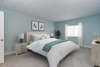 5800 Coach Gate Wynde Unit 295B, Louisville, KY 40207 - bedroom featuring light colored carpet and baseboards
