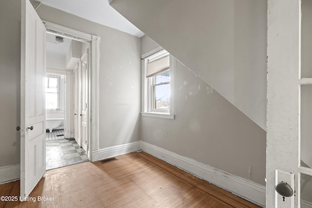 interior space featuring visible vents, baseboards, and light wood-style flooring