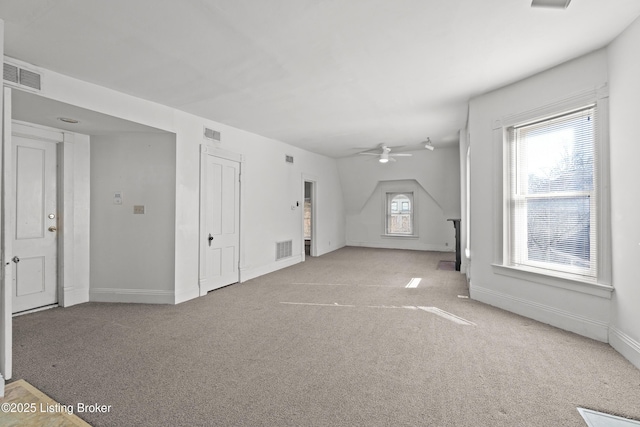 unfurnished living room featuring visible vents and carpet floors