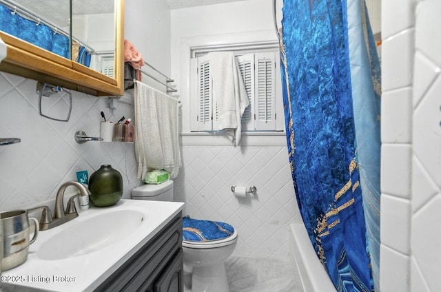 bathroom with toilet, shower / tub combo with curtain, tile walls, tile patterned flooring, and vanity