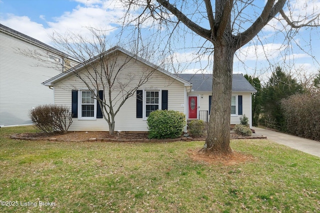 single story home featuring a front lawn