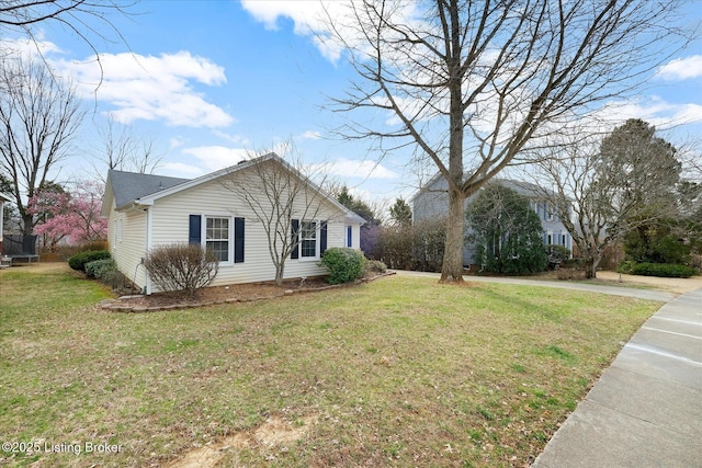 view of home's exterior featuring a yard