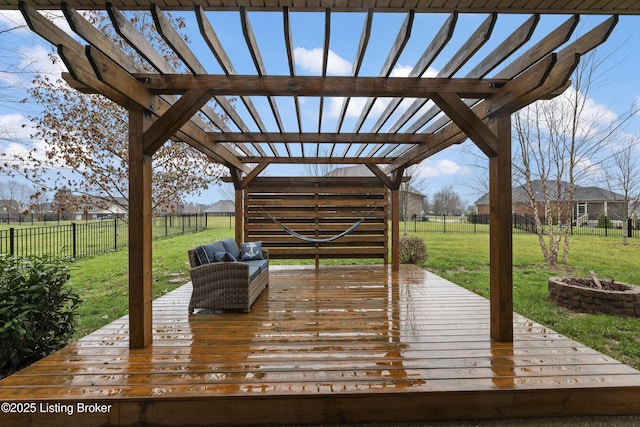 wooden terrace with a yard, a fire pit, a fenced backyard, and a pergola