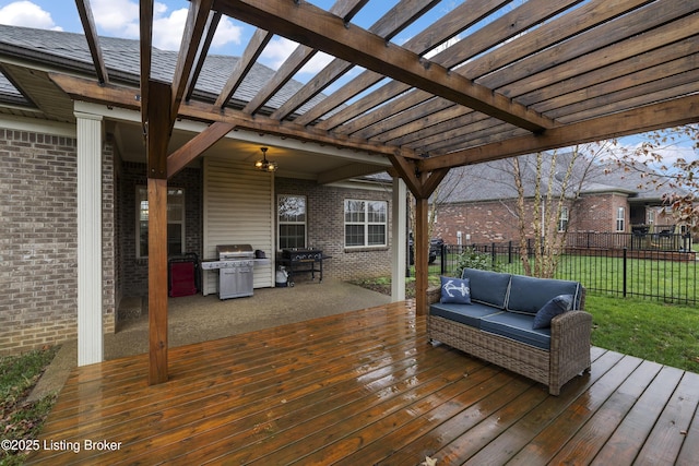 deck with outdoor lounge area, area for grilling, fence, and a pergola