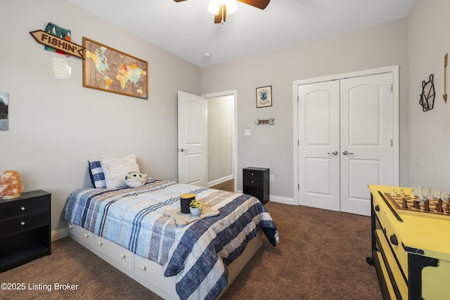 bedroom featuring ceiling fan, carpet, a closet, and baseboards