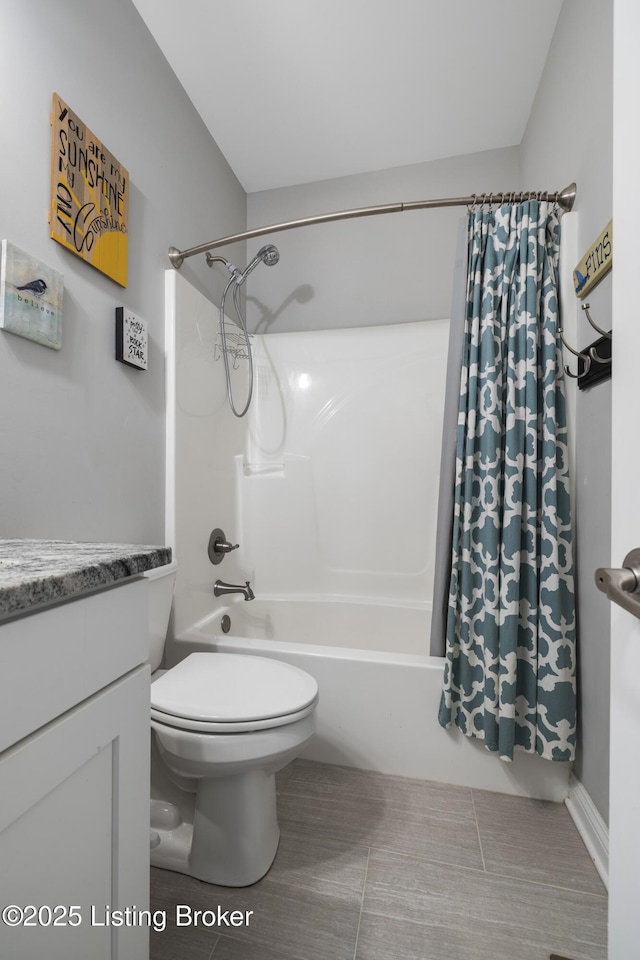 full bathroom featuring shower / bath combination with curtain, vanity, and toilet