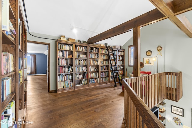 hallway with lofted ceiling with beams and wood finished floors