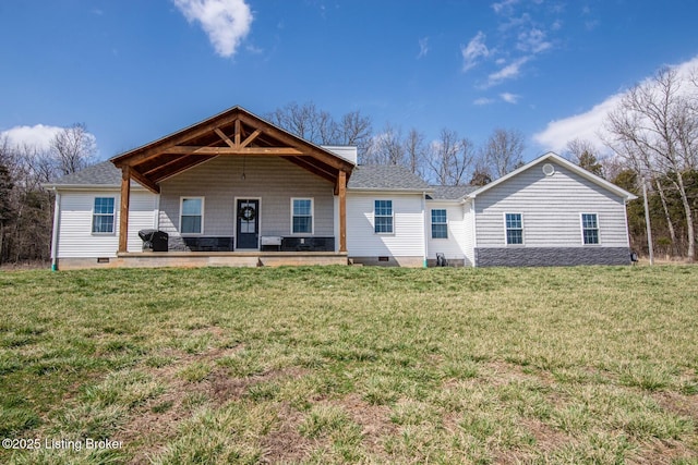 rear view of property featuring a yard, roof with shingles, and crawl space