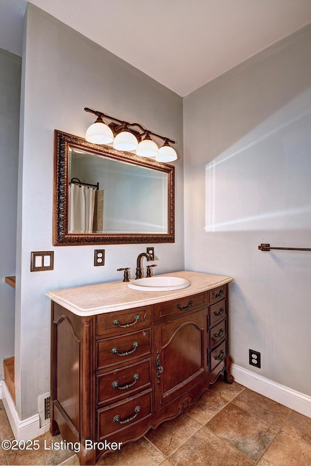 bathroom with vanity, a shower with shower curtain, baseboards, and visible vents