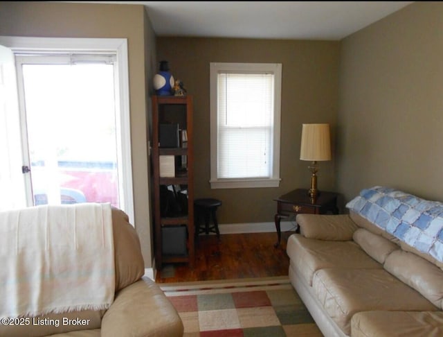 living area featuring wood finished floors and baseboards