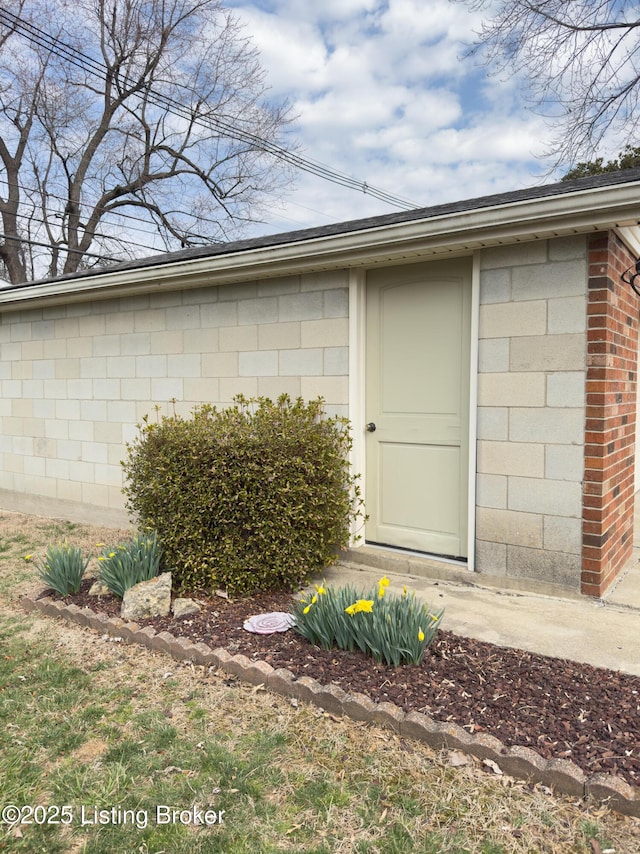 exterior space featuring concrete block siding